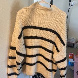 Striped white turtleneck sweater